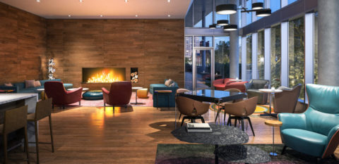 clubroom with seating area and fire place